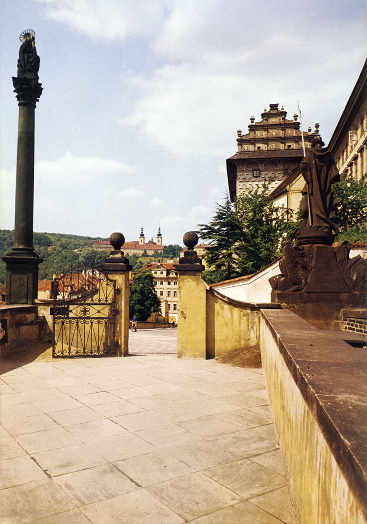 The Ramp of Prague Castle was built in 1663. It offers quite a remarkable view of the town and the slopes of Petfin Hill. In the background are the precincts of the Museum of National Literature, originally a Premonstratensian monastery founded in 1140.